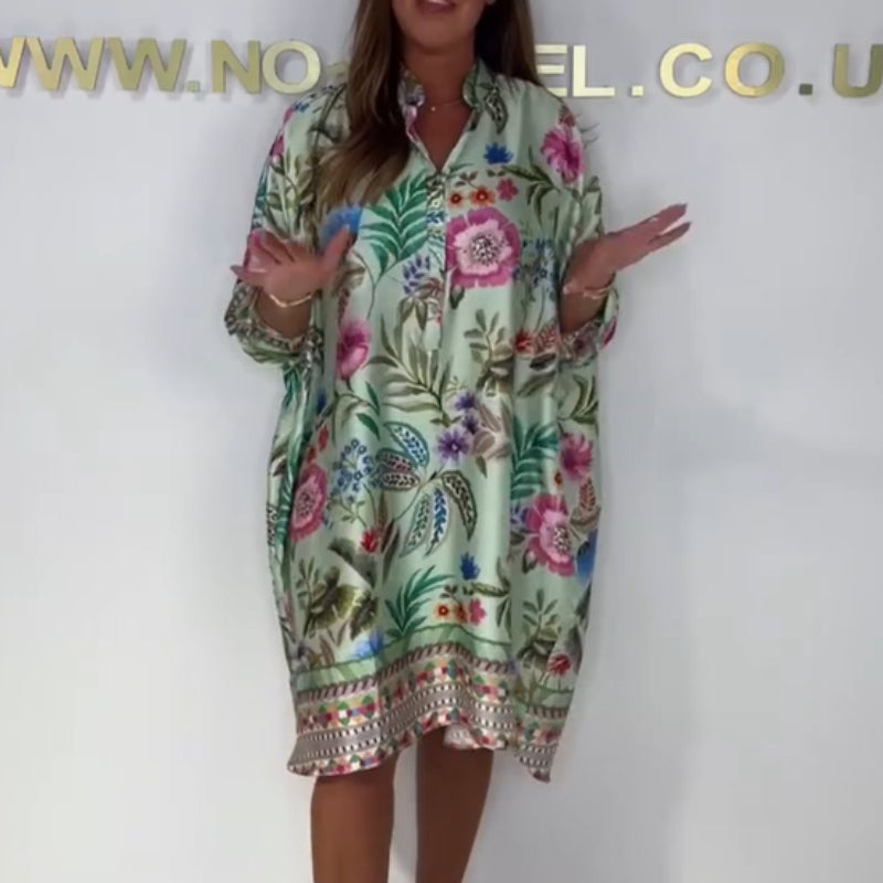 Loose dress with V-neck and half button placket with floral pattern