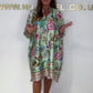 Loose dress with V-neck and half button placket with floral pattern
